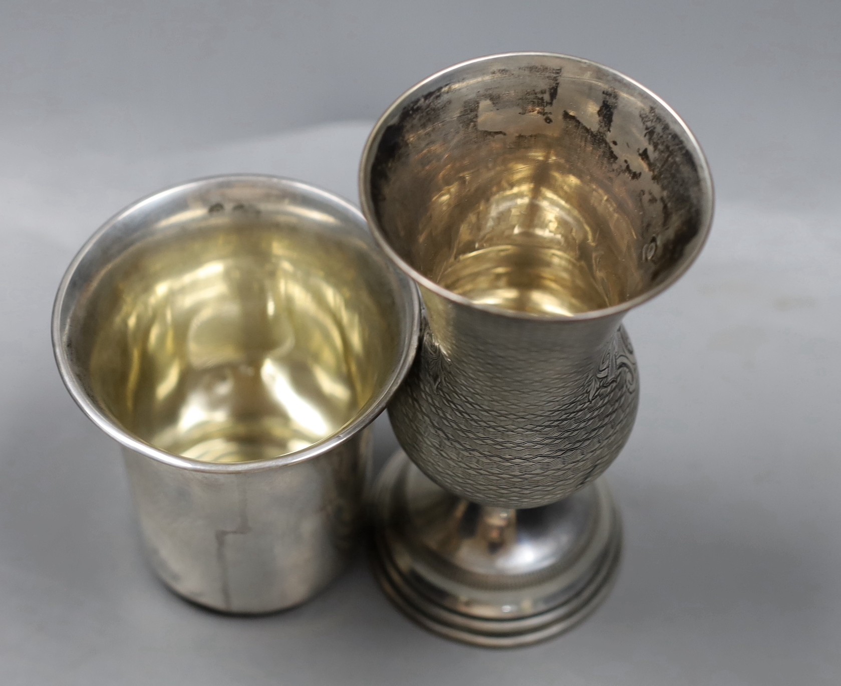 A late 19th/early 20th century Austro-Hungarian 800 standard white metal vase shaped cup, 12.6cm and a white metal beaker.